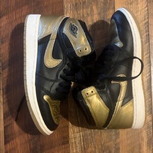 Nike Jordan 1 Black and Metallic Gold High-Top Sneakers
